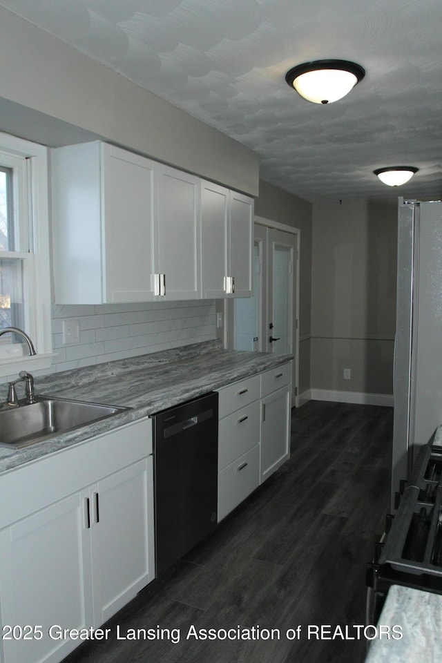 kitchen with white cabinetry, sink, dark hardwood / wood-style flooring, and dishwasher