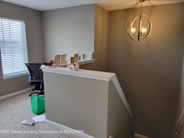 office space featuring an inviting chandelier and carpet floors