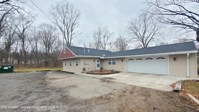 ranch-style home featuring a garage