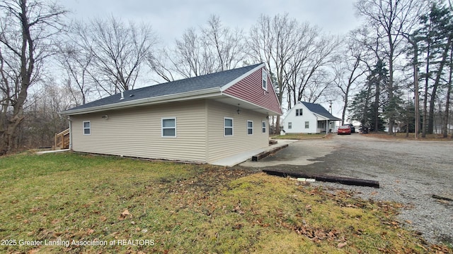 view of home's exterior with a lawn