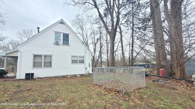 exterior space featuring a yard, cooling unit, and central AC unit