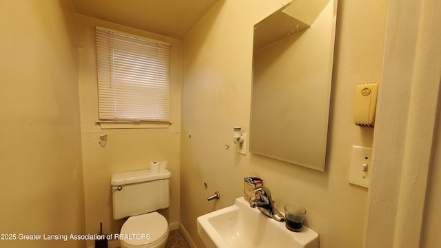 bathroom with toilet and sink