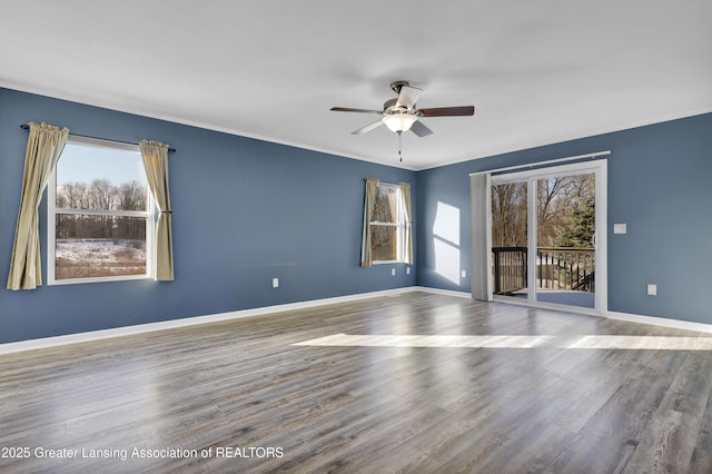 unfurnished room with hardwood / wood-style flooring and ceiling fan