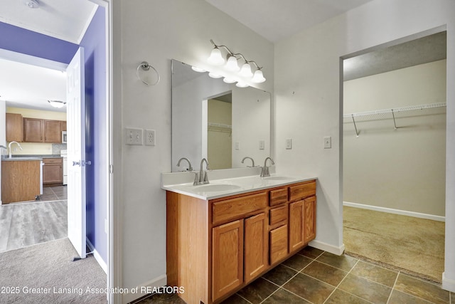 bathroom featuring tile patterned flooring and vanity