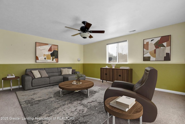 living room featuring carpet flooring and ceiling fan