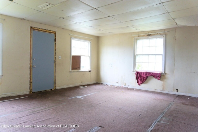 unfurnished room with a paneled ceiling