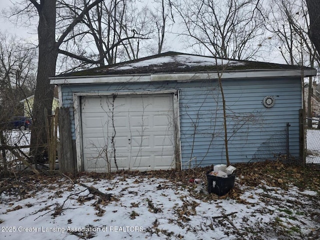 view of snow covered garage