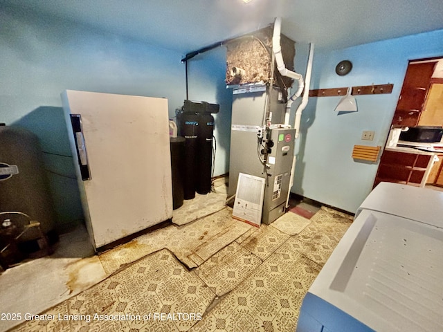 utility room with heating unit