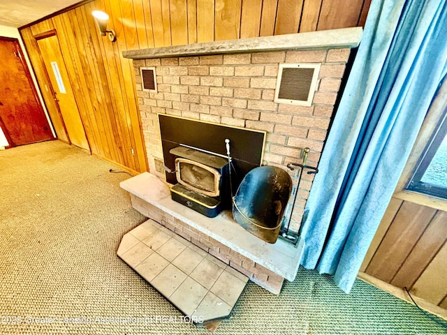 details featuring carpet floors and wood walls