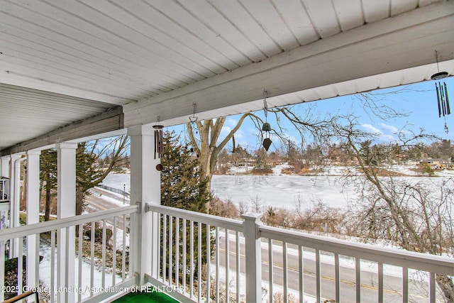 view of snow covered deck