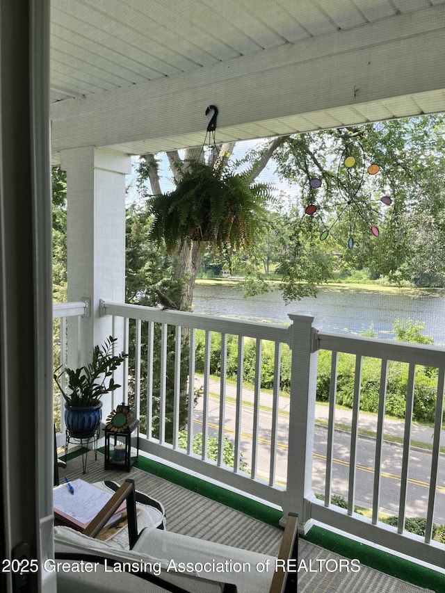 balcony featuring a water view