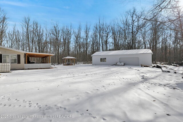 1987 W Isabella Rd, Midland, MI 48640 - exterior space featuring a garage and an outbuilding