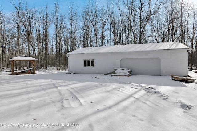 1987 W Isabella Rd, Midland, MI 48640 - snow covered structure with a garage