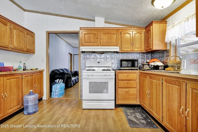 1987 W Isabella Rd, Midland, MI 48640 - kitchen with vaulted ceiling, white gas range oven, crown molding, a textured ceiling, and light hardwood / wood-style flooring