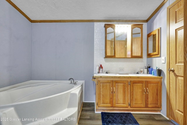 1987 W Isabella Rd, Midland, MI 48640 - bathroom with a tub to relax in, crown molding, wood-type flooring, and a textured ceiling