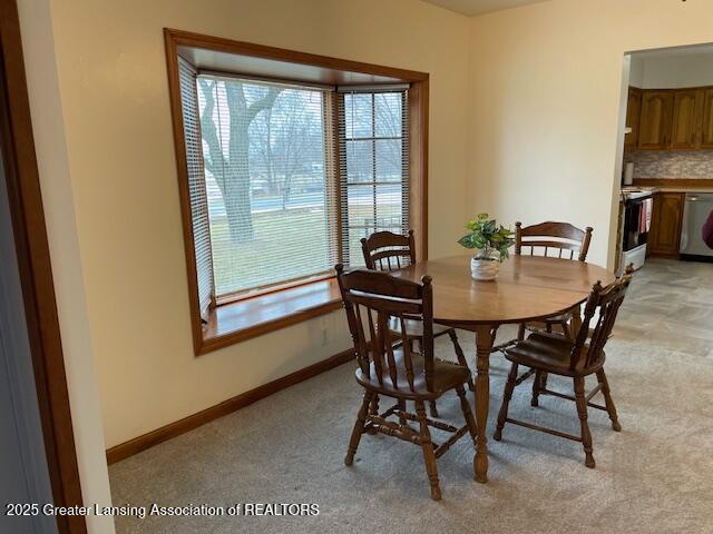 dining area featuring baseboards