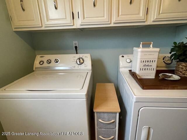 washroom featuring washing machine and dryer