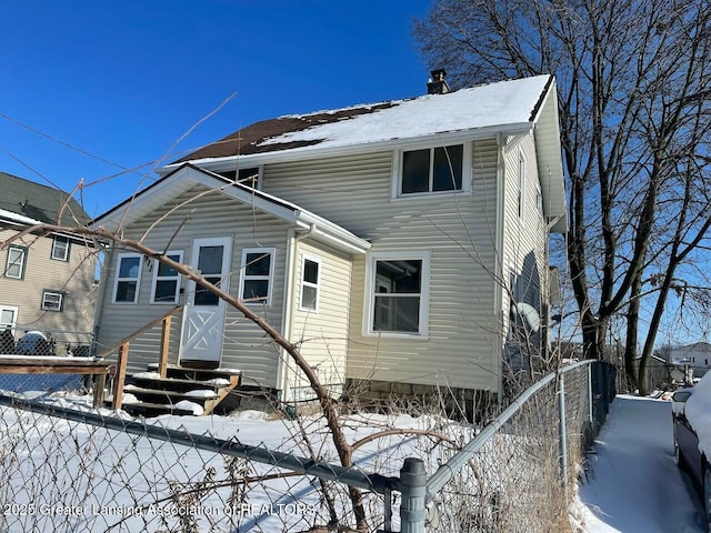 view of snow covered house