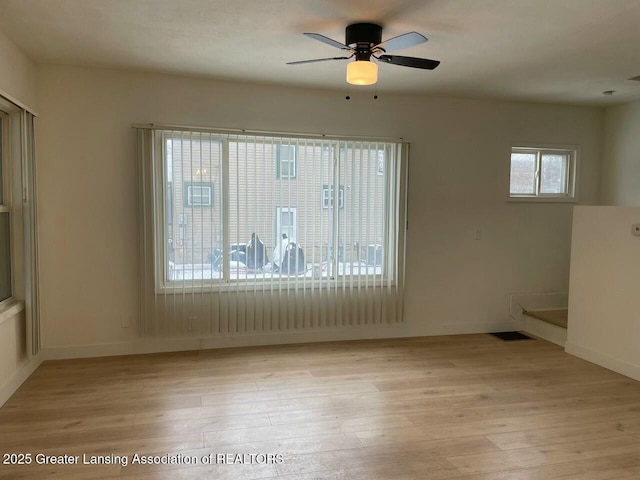 unfurnished room featuring ceiling fan and light hardwood / wood-style flooring