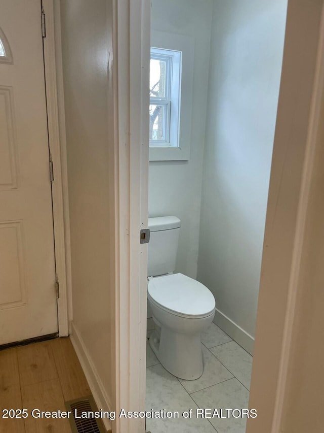 bathroom featuring tile patterned floors and toilet