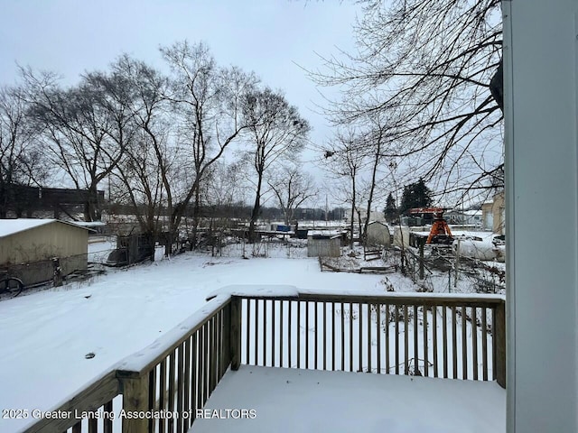 view of snow covered deck