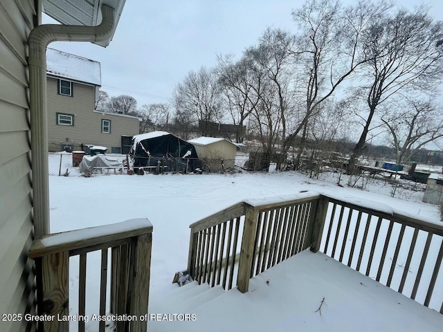 view of snow covered deck