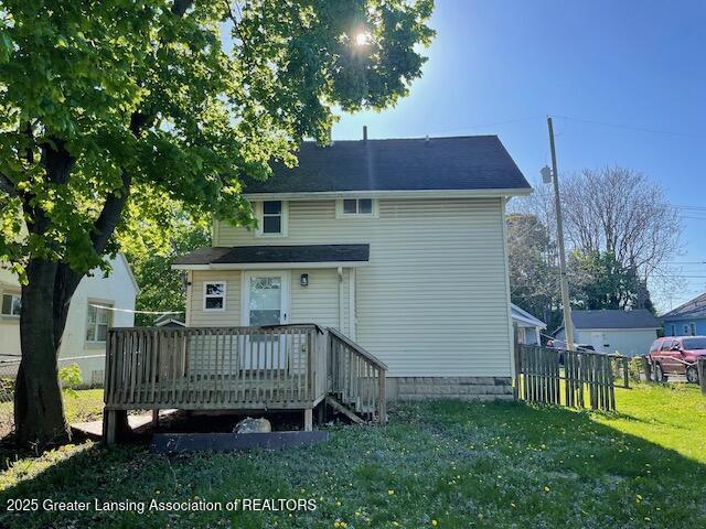 back of house featuring a deck