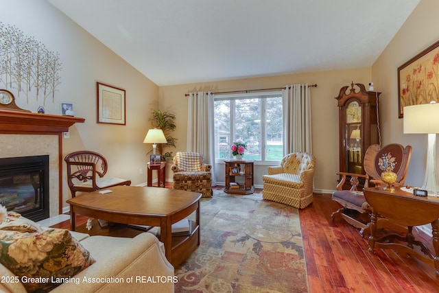 sitting room with lofted ceiling and hardwood / wood-style flooring