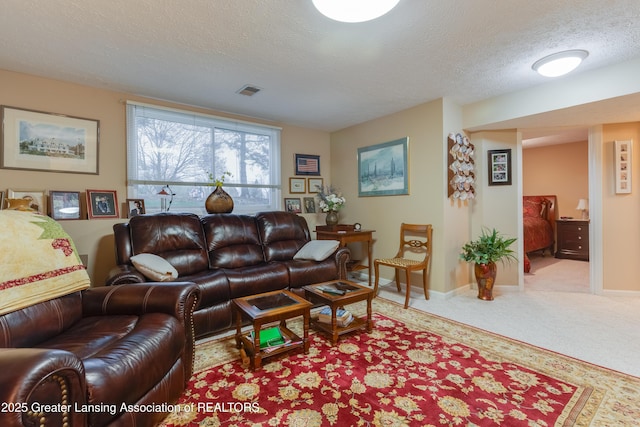 living room with light carpet and a textured ceiling