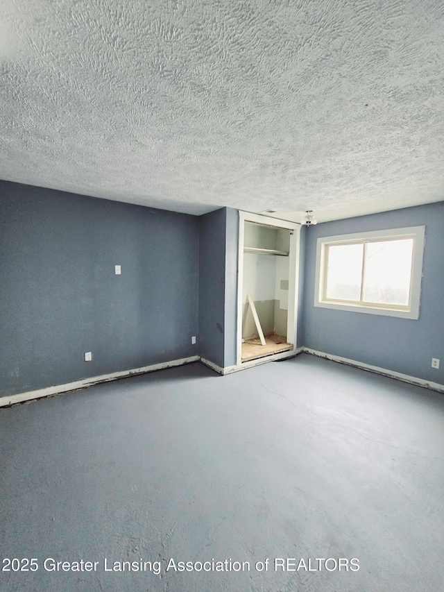 interior space featuring a textured ceiling