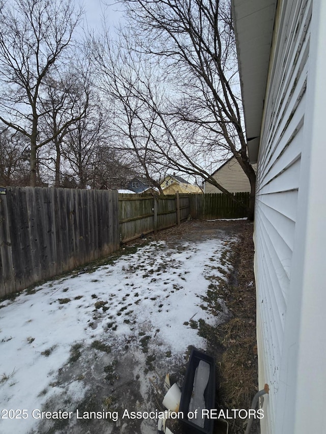 view of yard layered in snow