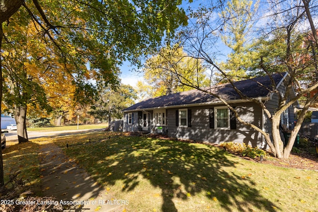 ranch-style house with a front lawn