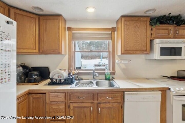 kitchen with sink and white appliances