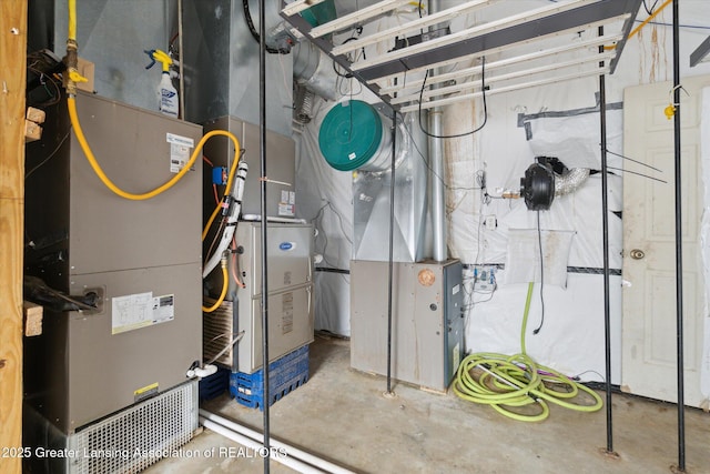 utility room featuring heating unit