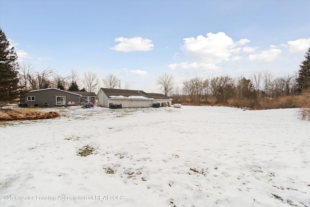 view of yard covered in snow