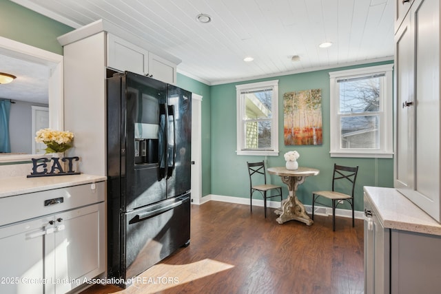 kitchen with crown molding, wood ceiling, dark hardwood / wood-style flooring, and black refrigerator with ice dispenser