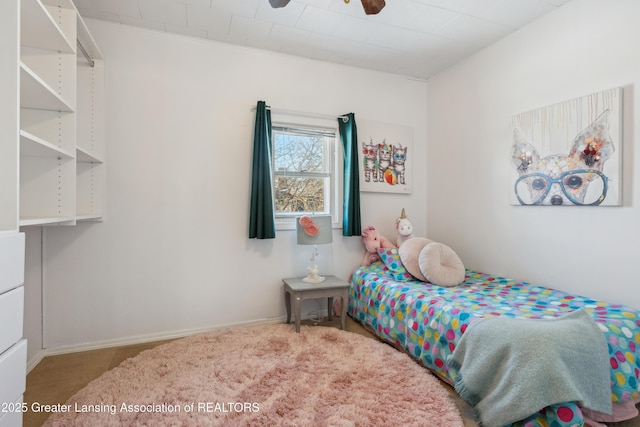 carpeted bedroom featuring ceiling fan