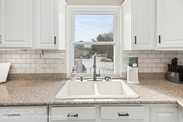 kitchen with white cabinetry, sink, tasteful backsplash, and dishwasher