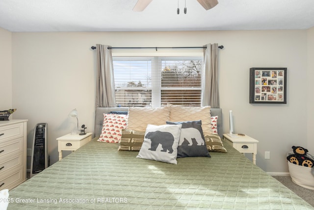 bedroom featuring light carpet and ceiling fan