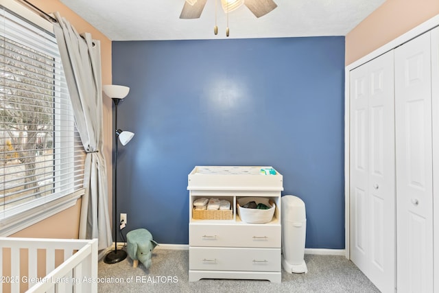 bedroom with carpet flooring, ceiling fan, and a closet