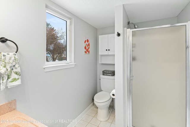 bathroom with tile patterned flooring, a shower with shower door, and toilet