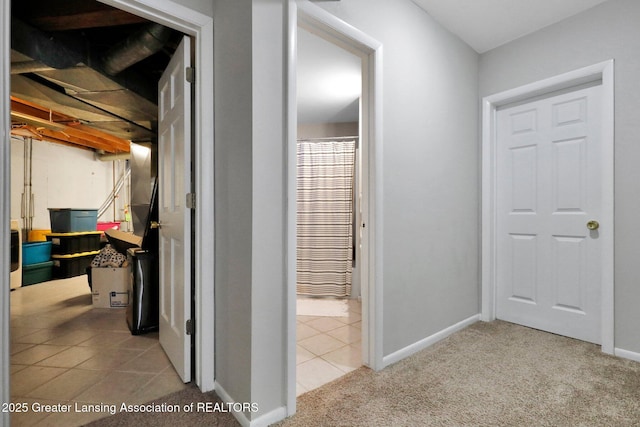 hallway with light tile patterned floors