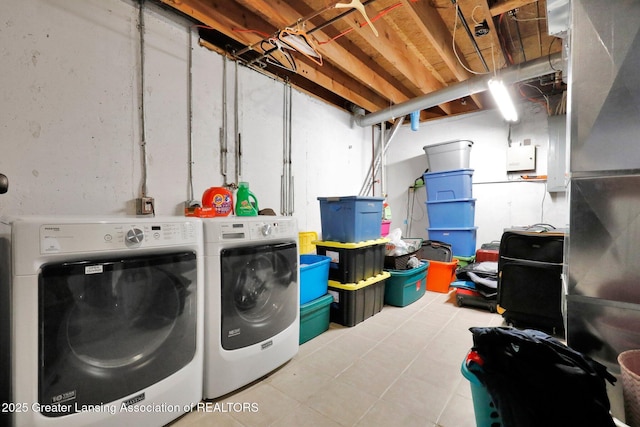 washroom with washing machine and clothes dryer