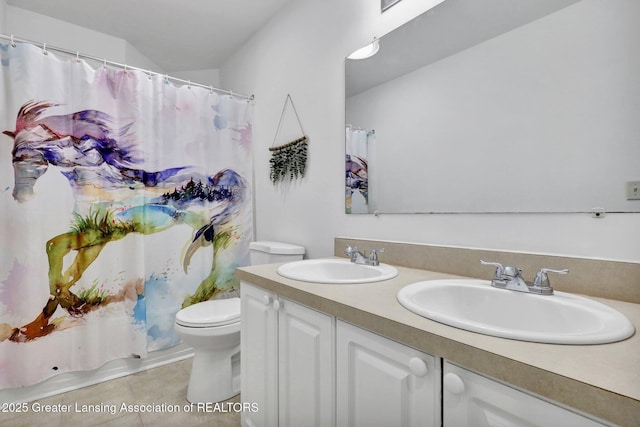 full bathroom featuring tile patterned flooring, vanity, shower / tub combo with curtain, and toilet