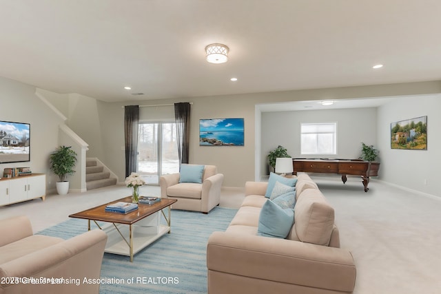 carpeted living room featuring a wealth of natural light