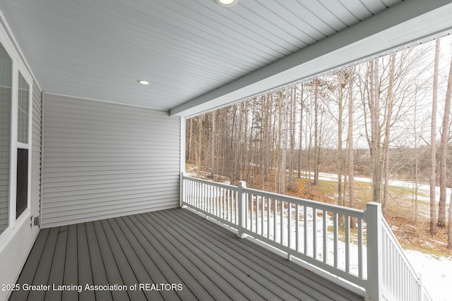 view of snow covered deck