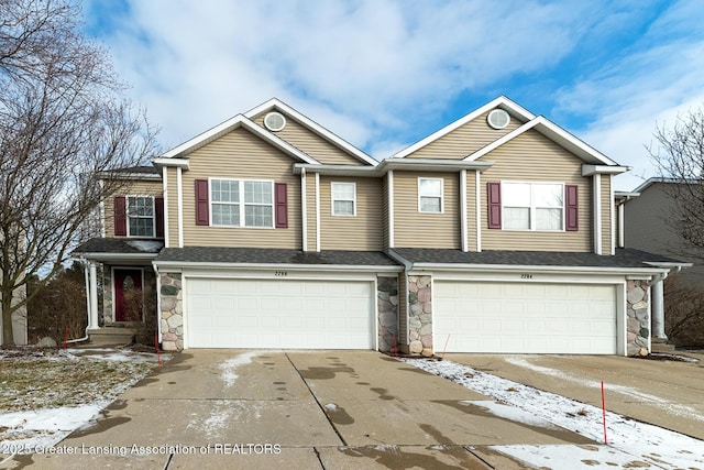 multi unit property featuring a garage