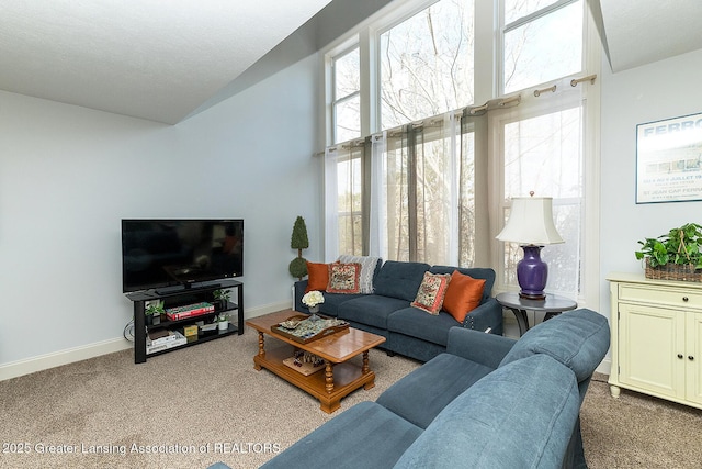 living room with light colored carpet and a textured ceiling