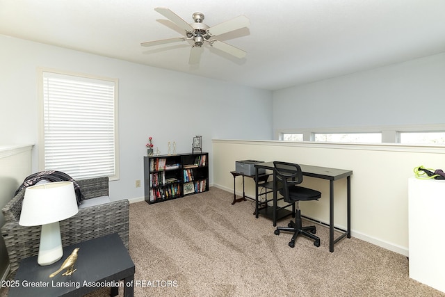 carpeted home office with ceiling fan