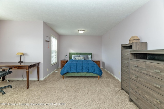 carpeted bedroom with a textured ceiling